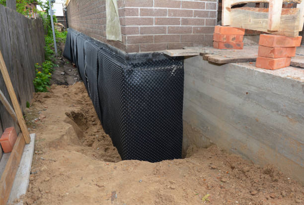 SJ Waterproofing Pros technician performing targeted Waterproofing assessment in Clarksville, IN